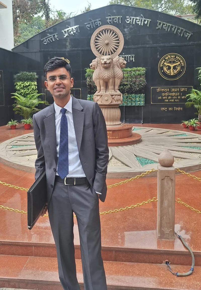 Abhay Pratap Singh, Rank 3 in UPPCS 2024, at the Uttar Pradesh Public Service Commission office in Prayagraj